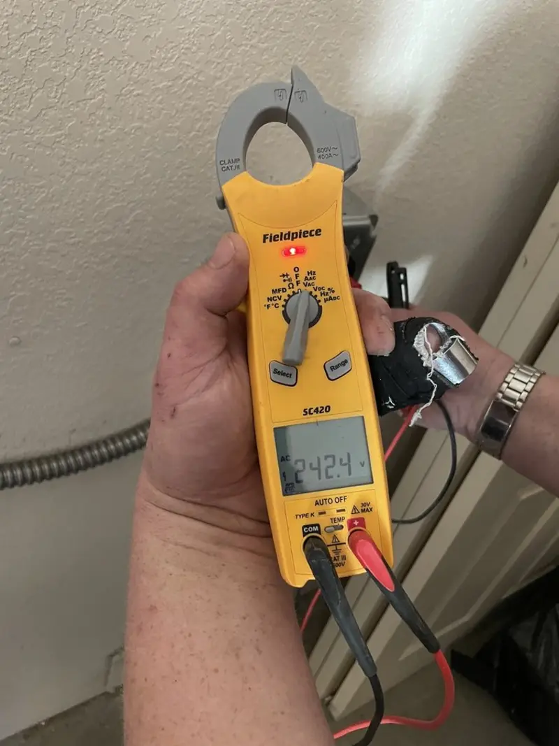 Voltage testing with clamp meter during Outlet Installation in Waveland
